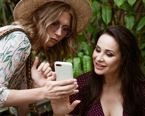 Attune Massage Therapy - Refer a Friend and Save One woman referring another to Attune Massage Therapy